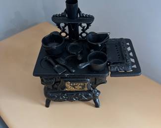 D160 - $60. Crescent Salesmans Sample Stove with accessories. 