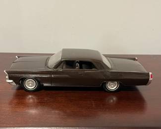 D96 - $80. 1963 Pontiac Bonneville Dealer Promo Car. One wheel is not attached but we have it. 