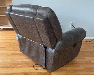 D14 - $225. Power Recliner in very good condition! Faux Leather. Measures 41" wide x 28" deep x 35" tall. Has USB plug with the electric recline buttons. 