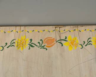 D64 - $30. Wooden Toy Storage Box on Wheels. Measures 44" wide x 23.25" deep x 14.5" tall. Stenciled floral top. Does NOT have safety hardware!