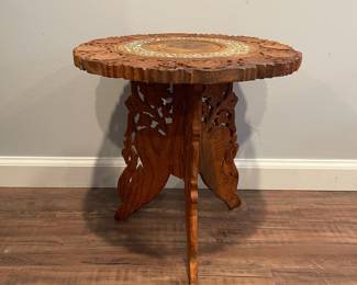 D63 - $40. Carved Wooden Table / Plant Stand with removable base. Inlay design on the top. Measures 15" across x 15.5" tall. 