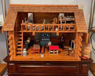 D60 - $50. Wooden Dollhouse. Measures 26" wide x 14.5" deep x 19.25" tall. 