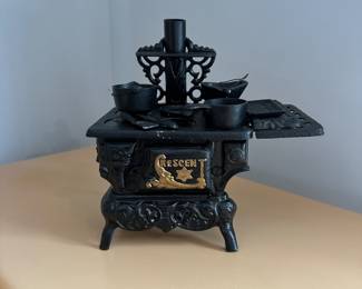 D160 - $60. Crescent Salesmans Sample Stove with accessories. 
