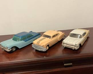 D97 - $65. Lot of 3 Promo Cars.  Left. 1954 Ideal Pontiac Star Chief Detroit Michigan. Middle 1954 Pontiac Chieftain Coupe Dealer Promo. Right - 1956 Johan Pontiac Star Chief Dealer Promo. 4 Door Hardtop.  