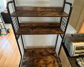 D144 - $60. Bakers Rack. Measures 26.75" x 15.5" x 68.25" tall. Light weight. 