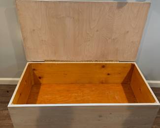 D64 - $30. Wooden Toy Storage Box on Wheels. Measures 44" wide x 23.25" deep x 14.5" tall. Stenciled floral top. Does NOT have safety hardware!