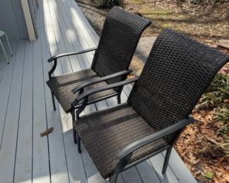 D133 - $30. Pair of woven plastic chairs. 