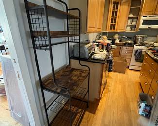 D144 - $60. Bakers Rack. Measures 26.75" x 15.5" x 68.25" tall. Light weight. 