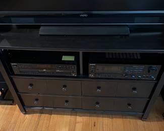 D100 - $20. TV Console. Measures 44.5" wide x 17.5" deep x 31" tall. 4 Drawers all slide easily.  Pressed wood - in fair / good condition. 
