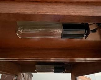 D31 - $85. Lighted Curio Cabinet with adjustable glass shelves. Measures 29" wide x 14" deep x 71" tall. Moves in 1 piece. 