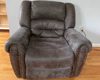 D14 - $225. Power Recliner in very good condition! Faux Leather. Measures 41" wide x 28" deep x 35" tall. Has USB plug with the electric recline buttons. 
