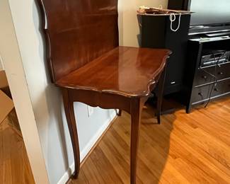 D44 - $60. Flip Top Game Table. Measures 41" x 21" deep x 30.5" tall. Has some veneer chipping. 