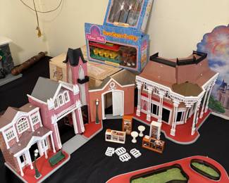 D17 - $75 SET. 1980s Disney Town Square. Good Played with condition. Most pieces are included, does NOT include any characters. Includes additional lighting system & Town Square Trolley. Sears exclusive. 