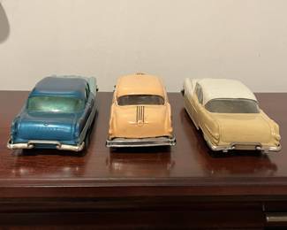 D97 - $65. Lot of 3 Promo Cars.  Left. 1954 Ideal Pontiac Star Chief Detroit Michigan. Middle 1954 Pontiac Chieftain Coupe Dealer Promo. Right - 1956 Johan Pontiac Star Chief Dealer Promo. 4 Door Hardtop.  