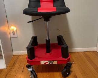 D26 - $60. Freeky Fit Rolling Shop Chair. Height is adjustable. Like new!
