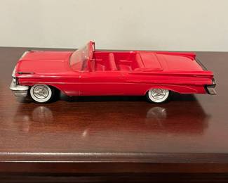 D92 - $50. 1959 Pontiac Bonneville 2 Door Convertible. Dealer Promo Car 1:25 scale. Sun visor is bent and there is a lot of wear on the Chrome accents.  