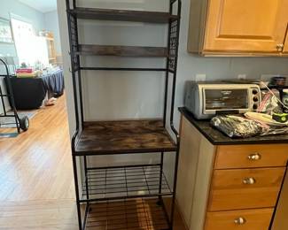 D144 - $60. Bakers Rack. Measures 26.75" x 15.5" x 68.25" tall. Light weight. 