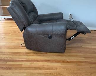 D14 - $225. Power Recliner in very good condition! Faux Leather. Measures 41" wide x 28" deep x 35" tall. Has USB plug with the electric recline buttons. 