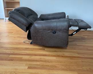 D14 - $225. Power Recliner in very good condition! Faux Leather. Measures 41" wide x 28" deep x 35" tall. Has USB plug with the electric recline buttons. 
