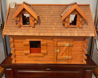 D60 - $50. Wooden Dollhouse. Measures 26" wide x 14.5" deep x 19.25" tall. 