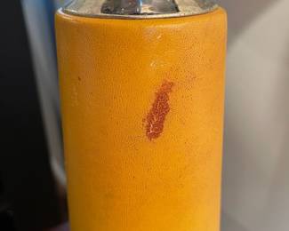 D67 - $30 PAIR of yellow leather wrapped lamps with Chrome accepts.  Leather has scratches/ marks, dents. Shows heavy use. Shades are ok. Measures 30.5" tall. 