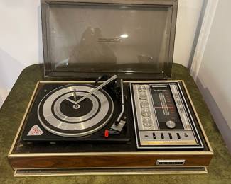D73 - $20. Electrophonic Gerrard Turn Table. Measures 24.5" x 15" deep x 9" tall. Does NOT power on and Cover is cracked. 