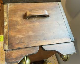 D65 - $45. *Small* Antique Wooden Chest on Wheels. Measures 25" wide x 11" deep x 11.5" tall. Top has some damage to the finish but it is solid wood. 