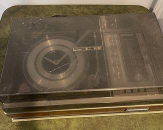 D73 - $20. Electrophonic Gerrard Turn Table. Measures 24.5" x 15" deep x 9" tall. Does NOT power on and Cover is cracked. 
