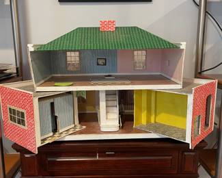 D58 - $20. Homemade Dollhouse crafted from wood / foamboard type material. Closed it measures 24" wide x 13" deep x 19" tall. 