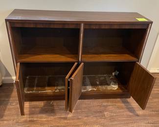 D69 - $30. Vintage Couch Table with Shelves. Measures 47" wide x 13" deep x 43.5" tall. Sturdy & Heavy! Wax paper is stuck inside on the bottom of the cabinet. 