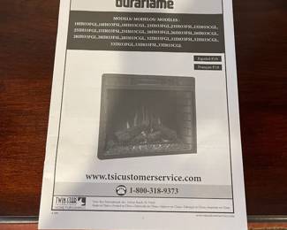 D59 - $30. Duraflame Electric Fireplace. NOTE - Front power button doesn't work but the remote does work! Measures 31" wide x 11.5" deep x 30" tall. 