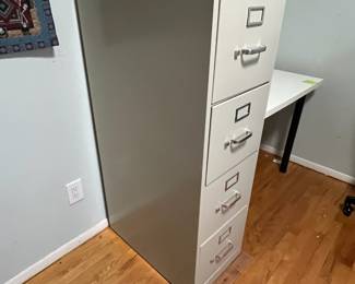 D28 - $25. Hon 4 Drawer Metal Filing Cabinet. Measures 15" wide x 25" deep x 48.75" tall. 