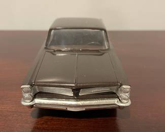 D96 - $80. 1963 Pontiac Bonneville Dealer Promo Car. One wheel is not attached but we have it. 