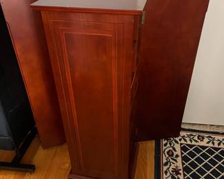 D45 - $50. Bombay Co. CD Cabinet. Doors on 2 sides to hide CDs. Shelves are not adjustable. Measures 12.5" x 13" x 37.5" tall. 