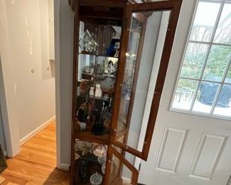 D31 - $85. Lighted Curio Cabinet with adjustable glass shelves. Measures 29" wide x 14" deep x 71" tall. Moves in 1 piece. 