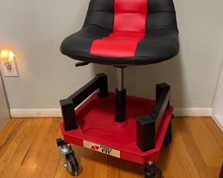 D26 - $60. Freeky Fit Rolling Shop Chair. Height is adjustable. Like new!