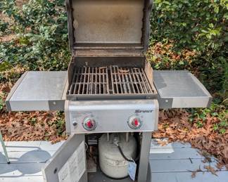 D128 - $100. Weber Spirit S210 Grill with cover and propane tank. 