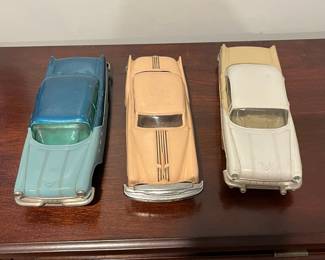 D97 - $65. Lot of 3 Promo Cars.  Left. 1954 Ideal Pontiac Star Chief Detroit Michigan. Middle 1954 Pontiac Chieftain Coupe Dealer Promo. Right - 1956 Johan Pontiac Star Chief Dealer Promo. 4 Door Hardtop.  