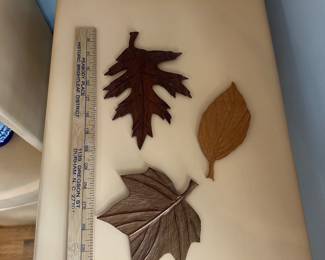 D164 - $12. Set of 3 wooden carved leaves that hang on the wall. 