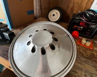 Three barracuda hubcaps