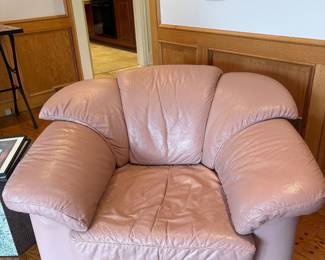 One of two Italian leather lounge chairs. Both have matching ottomans. There is also a love seat and a couch in the same set.