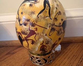 Signed Susan Cameran painted "Bushmen" ostrich egg on stand