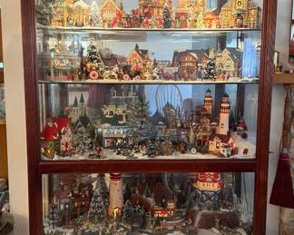 5 shelves of Ace Hardware Christmas Village and Disney Scenes including beautiful lighted cabinet - all for $1,100.