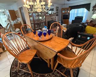 64” round oak drop leaf table with 4 Windsor style chairs