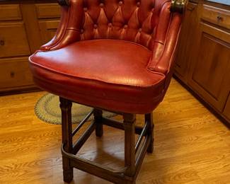 Red Tufted Leather Swivel Bar Stool with Carved Wood Accents