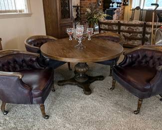 Vintage Oak Pedestal Dining Table with Four Leather Upholstered Barrel Chairs