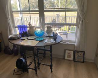 Vintage gated, drop leaf table with decor and artwork