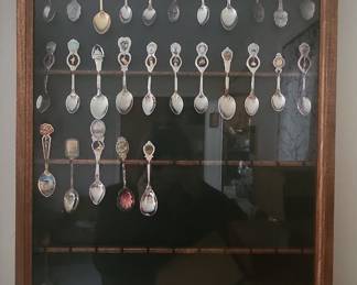 Collection of Souvenir Spoons in Display Case