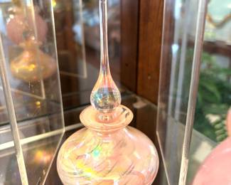 Opalescent pink perfume bottle