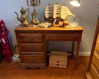 Antique wood desk, brass candelabra, brass tea set, ship figurine